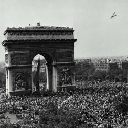 A parade at the Arc de Triomphe after the end of World War Two